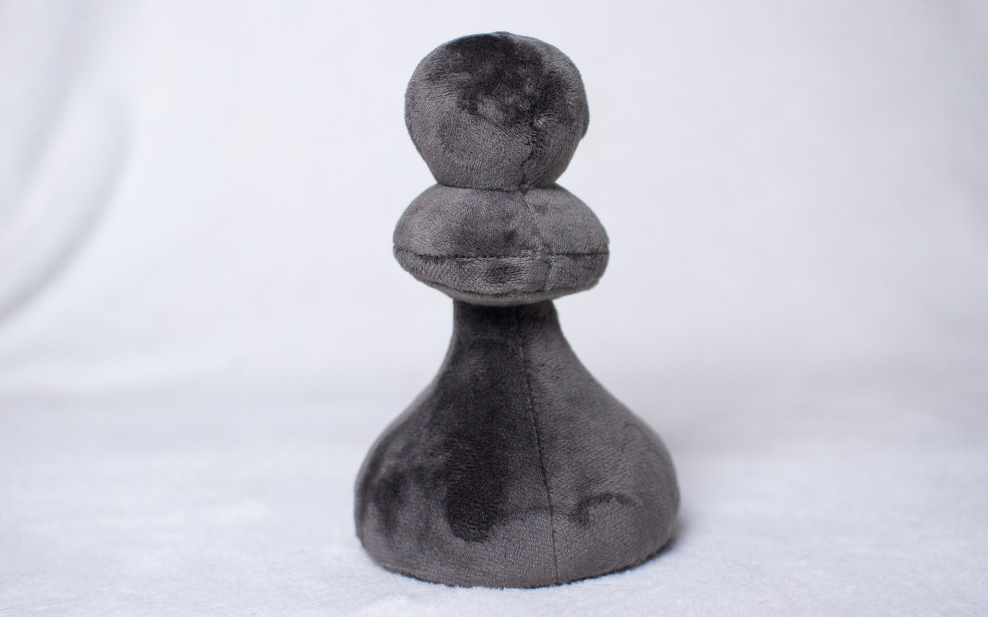 Plush Gray Pawn Toy