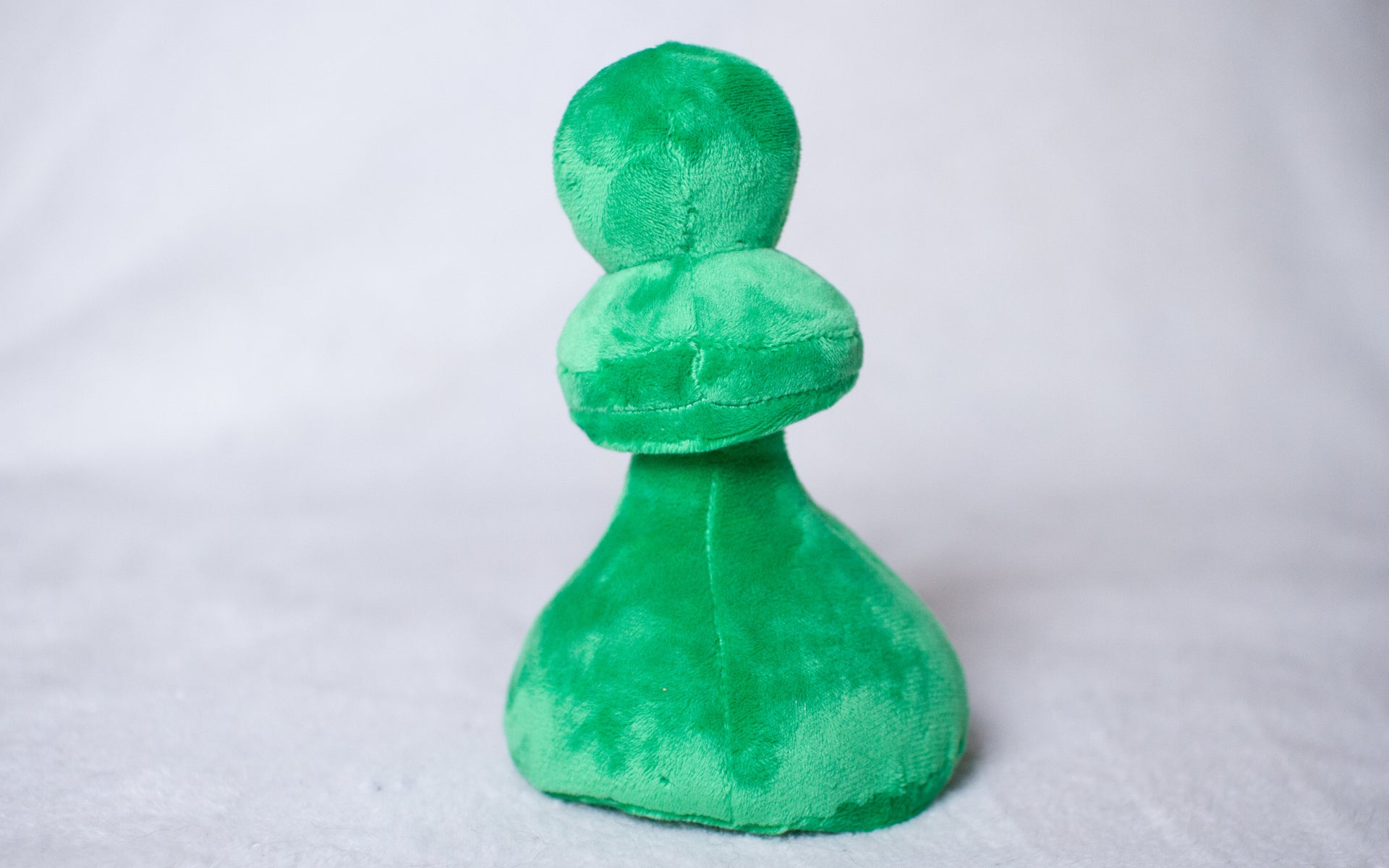 Plush Green Pawn Toy