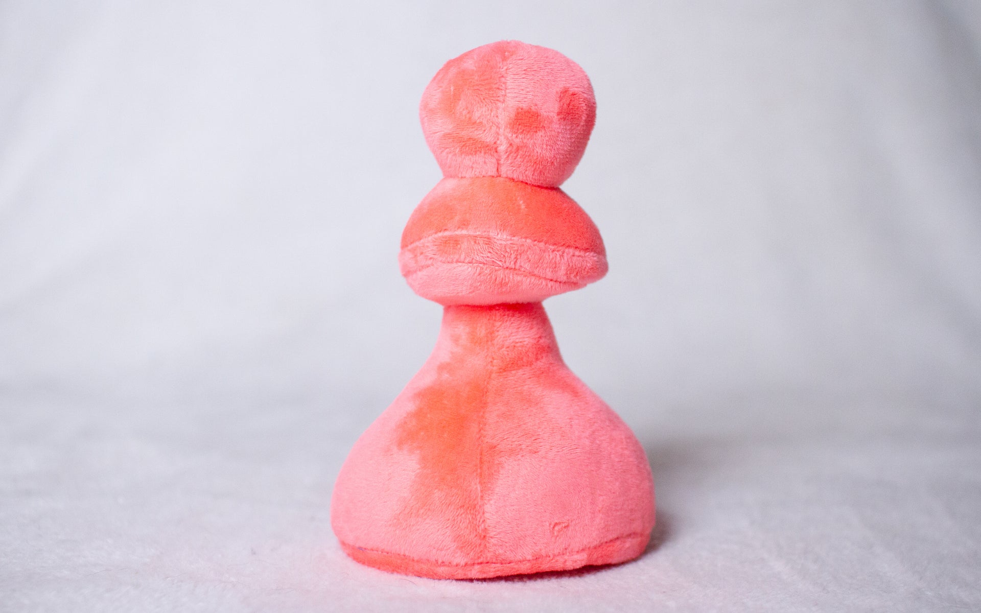 Plush Pink Pawn Toy